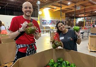 Patelco Team Members sorting food at Alameda County Community Food Bank.